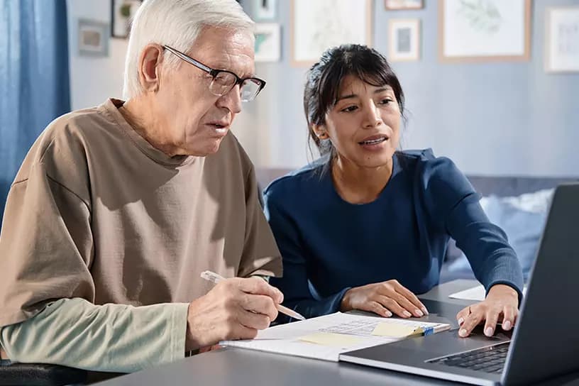 IHSS caregiver helping elderly patient at home